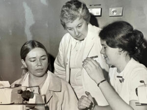 Nancy Nienhuis, known as “Nurse Nancy” at the Janesville GM plant, working with nursing students.