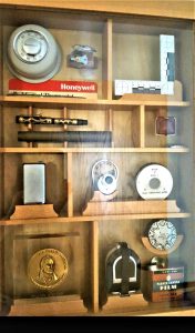 A shadowbox made by Bill’s son displaying Hyzer’s many inventions.